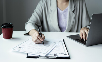 Business woman employer holding resume hiring recruit looking cv resume to hire candidates, analyzing information before job interview. Recruitment concepts