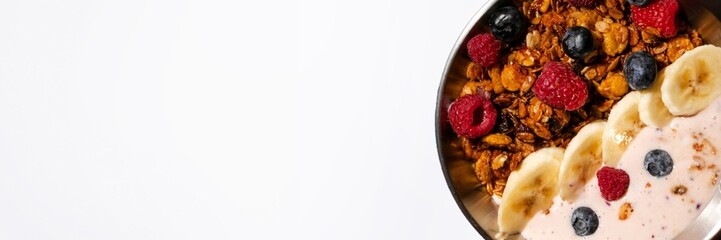 A healthy breakfast bowl featuring granola, yogurt, and fresh fruits promoting nutritious eating habits