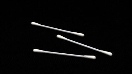 Cotton swabs isolated on black background