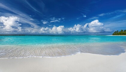 Fototapeta premium Beautiful sandy beach with white sand and rolling calm wave of turquoise ocean on Sunny day 