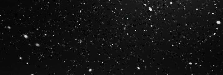 Obraz premium Slow Motion Snowfall on Black Background