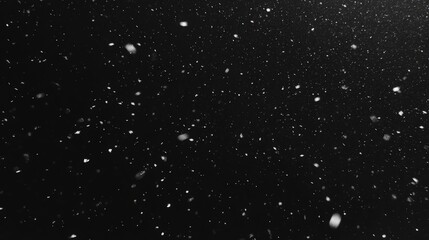 Obraz premium Snow Falling on Black Background in Slow Motion