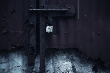Rusted lock with rusted iron gate, broken rusted gate with rusted locks, rusted Indian locks with dark colored and silver rusted one