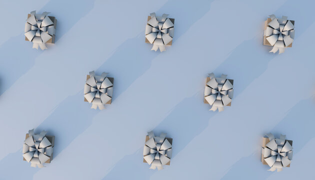 Tied gift boxes arranged in row against colored background