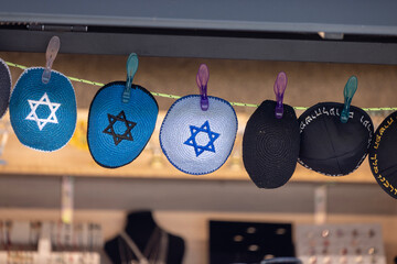 Prague, Czech Republic - September 4, 2024: Colorful handmade Jewish caps with Star of David,...