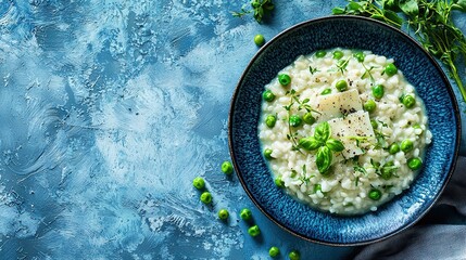   A blue bowl sits atop a blue tablecloth, brimming with rice and peas A sprig of parsley rests beside it