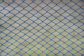 Fototapeta premium Chain link fence stands out against a softly blurred background symbolizing boundaries separation