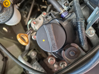 cap the hole for filling engine oil in a car