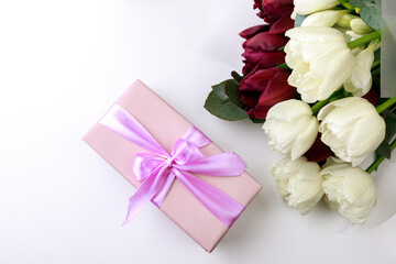  tulips  and gift box on white background. Stylish soft image of spring flowers. Happy womens day. Happy Mothers day- Image