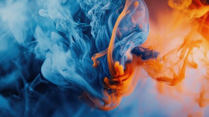 Abstract blue and orange ink suspended in fluid motion, creating swirling shapes and textures.