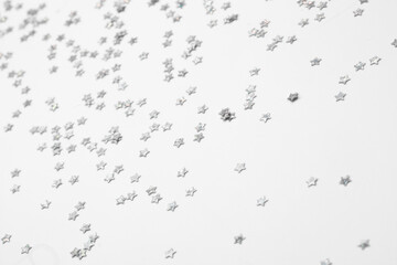 sparkles silver stars on white background with text place- Image