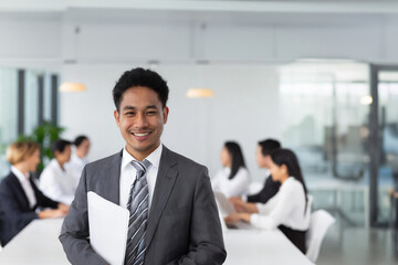 Fototapeta premium Smiling Businessman Leading Office Meeting