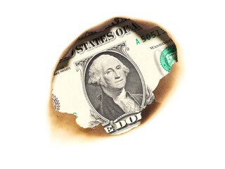 one dollar in the burned hole of paper isolated on white background