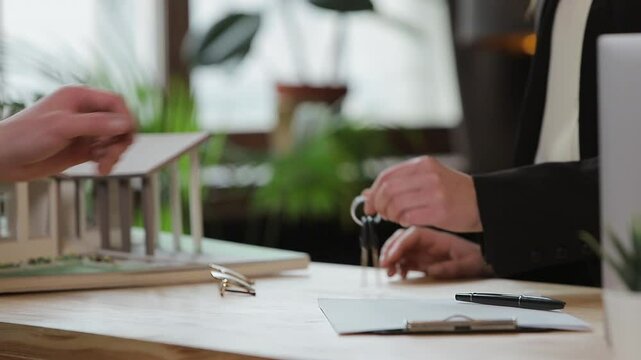 Man sign mortgage contract, put signature on sale purchase rental agreement, handshaking realtor at meeting with estate agent, satisfied customers buy property, get keys of new home.