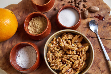 Top view of the ingredients and spices for the pumpkin pie on a wooden tray