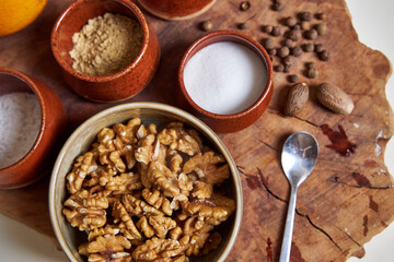 Top view of the ingredients and spices for the pumpkin pie on a wooden tray