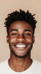 Obraz premium A front portrait of a young African man, smiling, centered, short curly black hair, dark brown skin, plain beige background