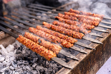  Turkish Kebab On The Grill. Barbecue grliling shish kebab , shish kebab in smoke over coal fire