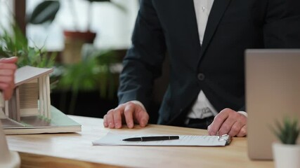 business, real estate, deal and people concept - man giving house keys to woman at office.