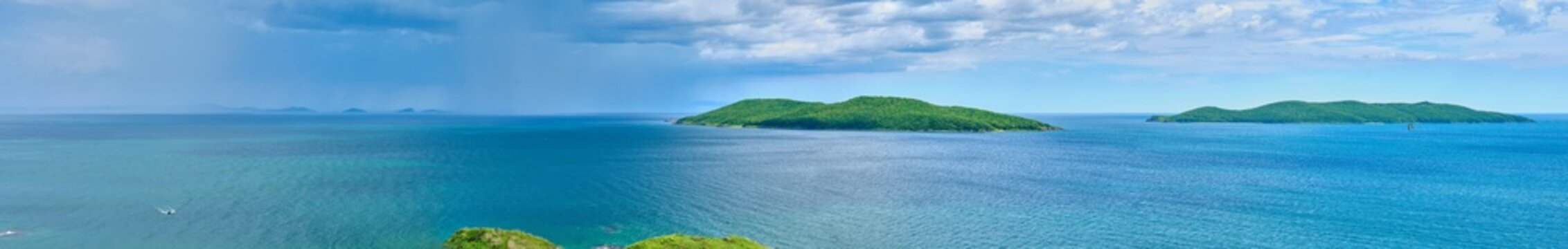 The nature of the Khasansky district of Primorsky Krai, Russia. The lip of the Teal of the Slavic Bay, the inner bay of Peter the Great in the summer. Panorama.