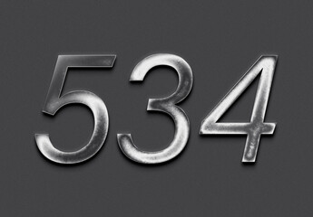 Chrome metal 3D number design of 534 on grey background.