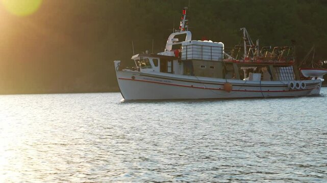 fishing boat returning from a night fishing in the morning. June 5, 2024 at the port in the fishing village of Pirgi Lesbos, Greece