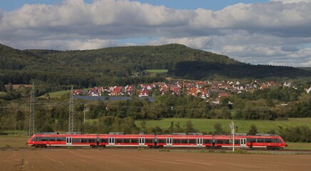 Henfenfeld, Bavaria, Germany September 29 2024 - S-Bahn between Hersbruck and Henfenfeld Train in Landscape Countryside with Village