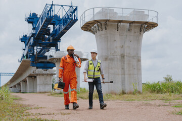 Surveying engineers take measurements with theodolite instruments at construction sites. Surveyors...