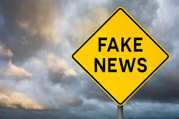 Fake News Warning Sign Against Stormy Sky
