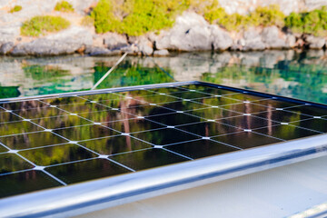 marine solar panels on top of multihull boat, environment and sea ocean friendly sustainable technology