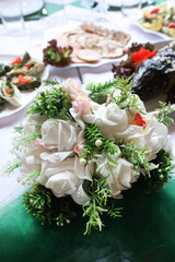A bouquet of flowers decorates the festive table. Decoration of the festive table.