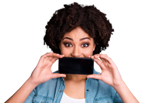 Close up photo beautiful amazing she her dark skin lady arms hands hold telephone smart phone hide mouth funky make take pictures images wear casual jeans denim shirt isolated grey background