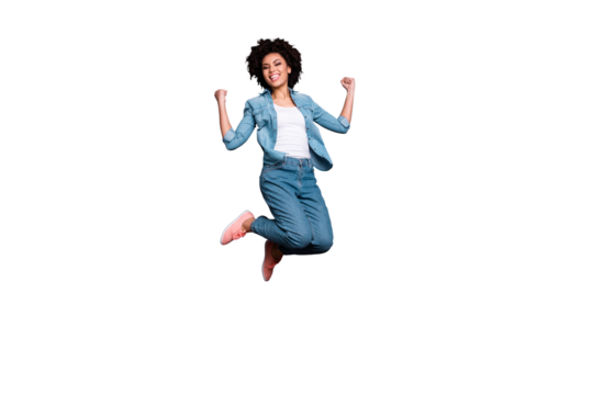Full length body size photo beautiful she her dark skin lady jump high arms hands raised up air champion triumphant glory luck yeah wear casual jeans denim shirt isolated grey background