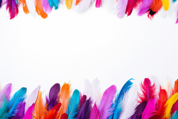 Vibrant collection of colorful feathers arranged artistically on a bright white background