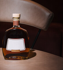 Bottle of cognac resting on a bar table in a nightclub