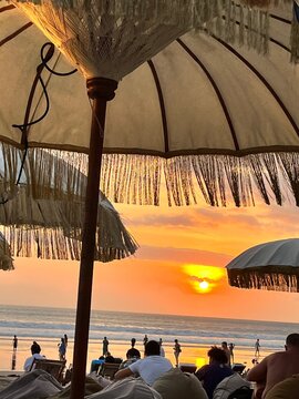 Point of view sunset beds and umbrellas at beatch 