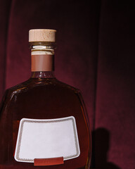 Premium bottle of brandy on elegant background