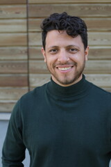 Obraz premium Handsome bearded man wearing an elegant turtle neck sweater 