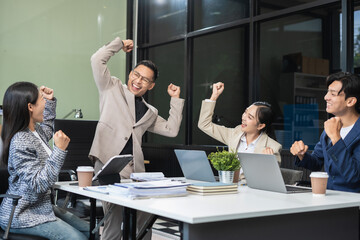 Group of Young Asian business team creative businesspeople coworker in office. Meeting Presentation for analysis graph company financial. People Work in Business Office.