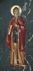 Obraz premium Traditional Christian icon of Saint Prochor Pecersky. Antique illustration on cracked wall in Byzantine style