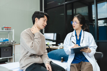 Fototapeta premium doctor consulting patient filling form at consultation, talking to patient filling signing medical paper at appointment visit in clinic.