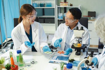 Team Microbiologists Analyzing Molecular Samples in Advanced Food Science Laboratory, Dietitian...