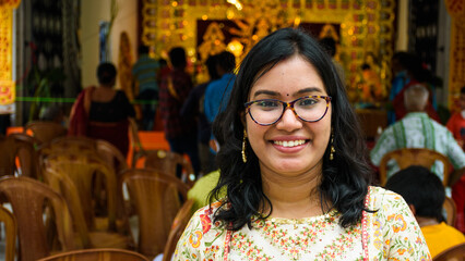 Happy young Bengali woman celebrates Sindur Khela tradition in Durga puja festival. Durga puja...