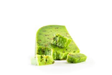 Green pesto cheese isolated on white background. Dutch green cheese. food concept