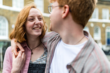 Young couple holding hands and looking at each other