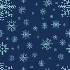 Seamless winter pattern with snowflakes on a blue background, perfect for festive or seasonal designs