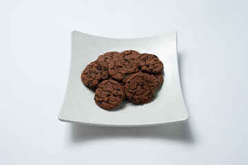 Chocolate chip cookies on a white plate