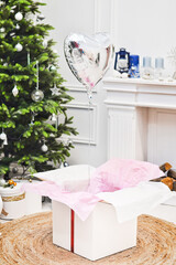 Present box with red ribbon and balon for christmas © Anton