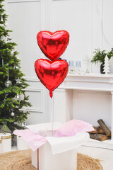 Present box with red ribbon and balon for christmas © Anton