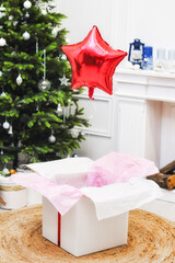Present box with red ribbon and balon for christmas